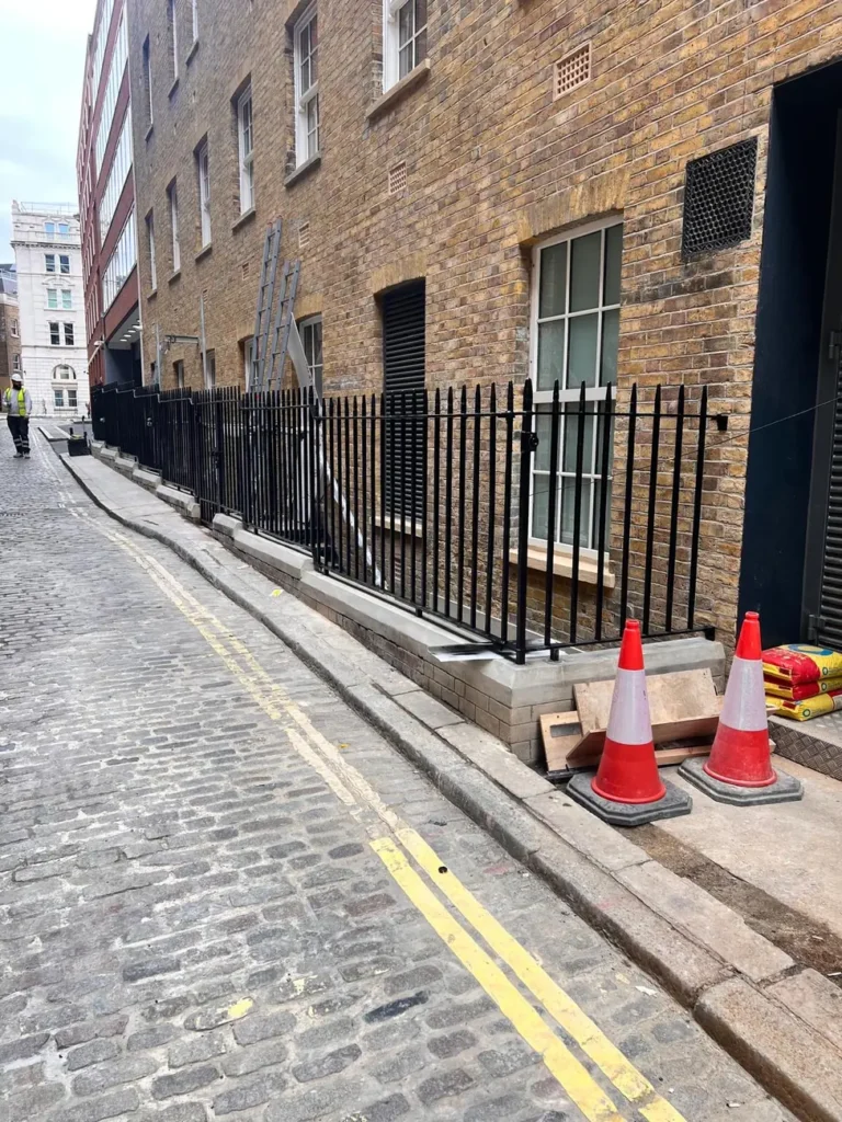 Black railings along a Victorian London street