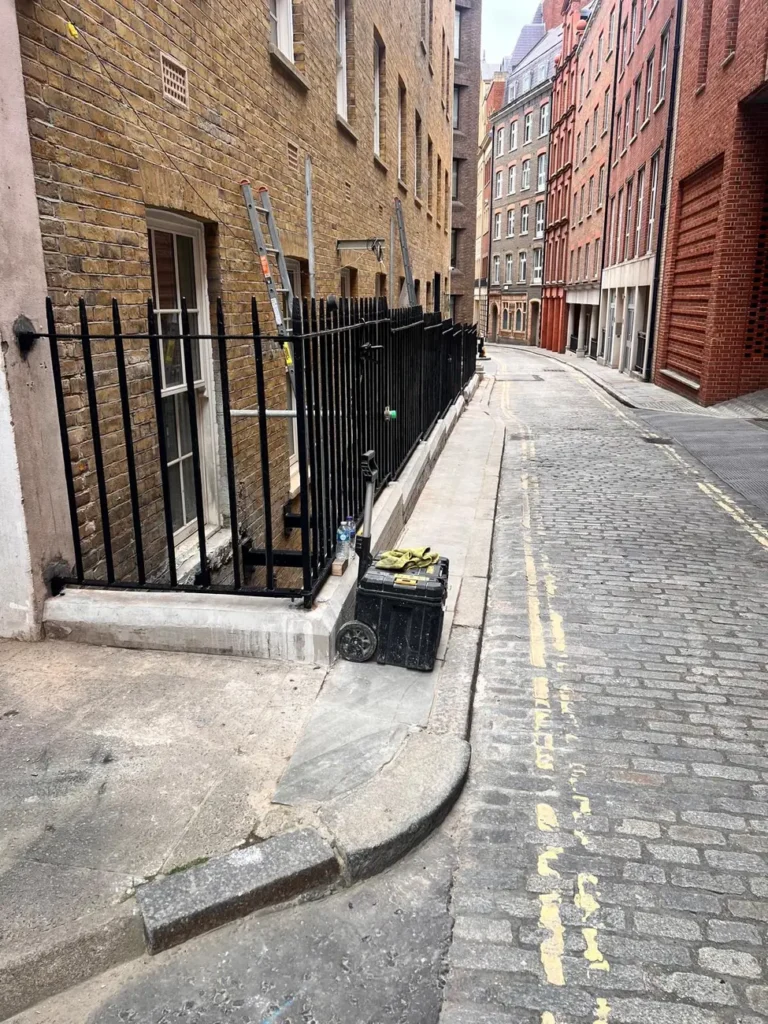 Black railings to a townhouse on a London street
