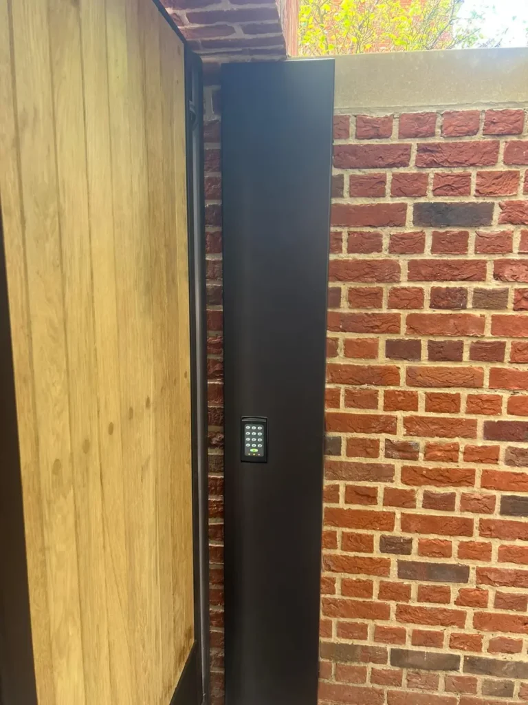 A closed timber-clad gate in a red-brick surround