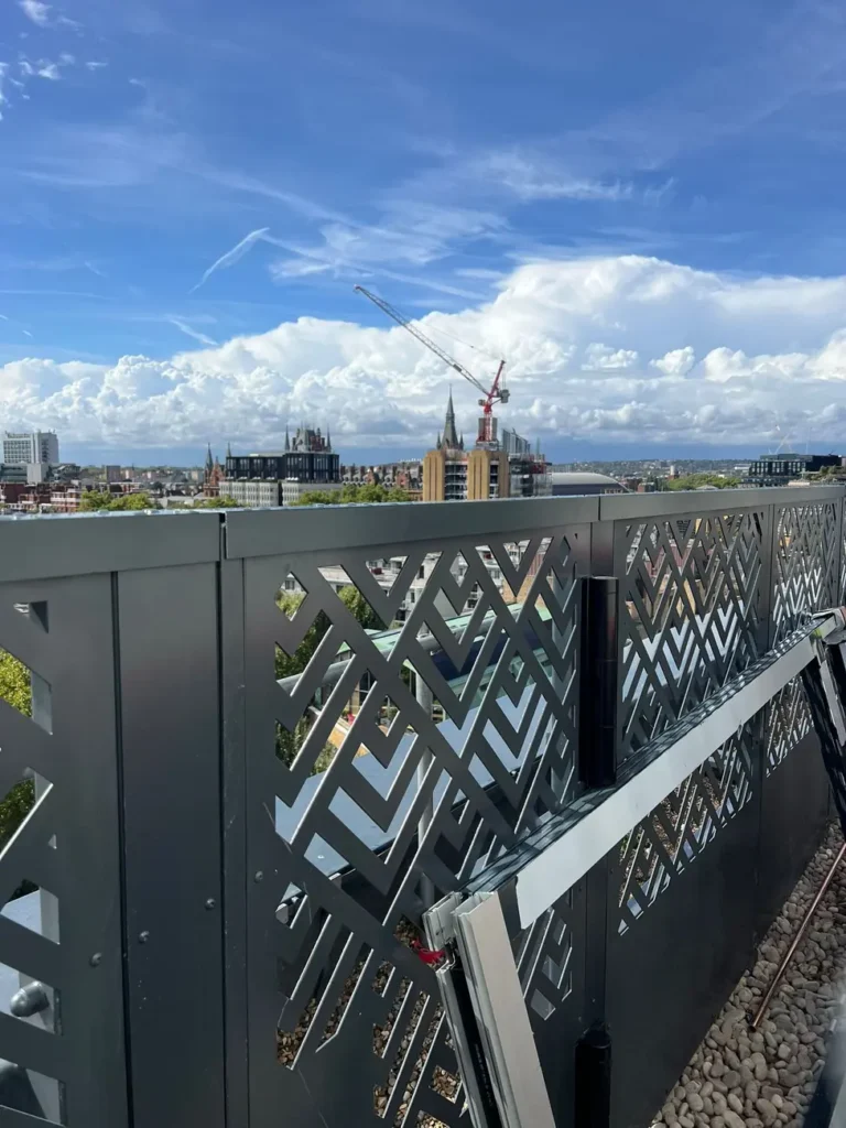 Decorative laser-cut metal screen panels on a rooftop