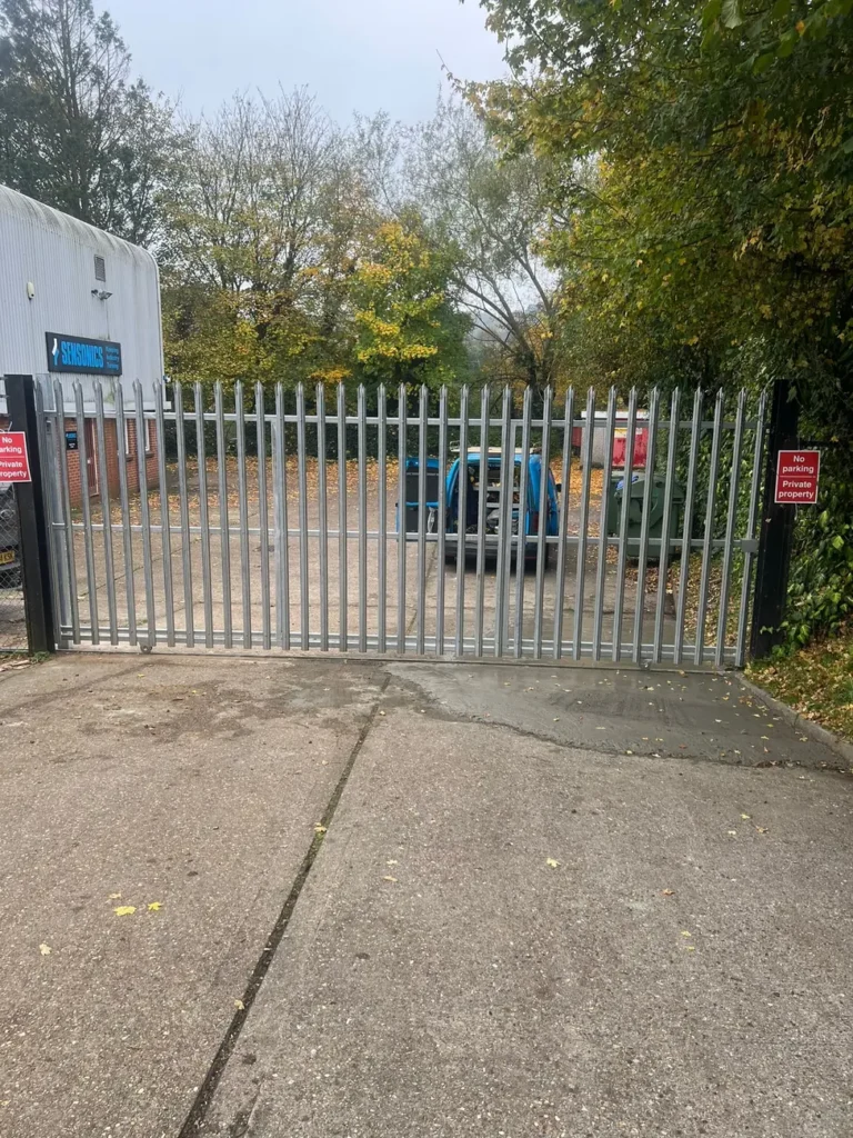 A galvanised palisade gate to a commercial yard