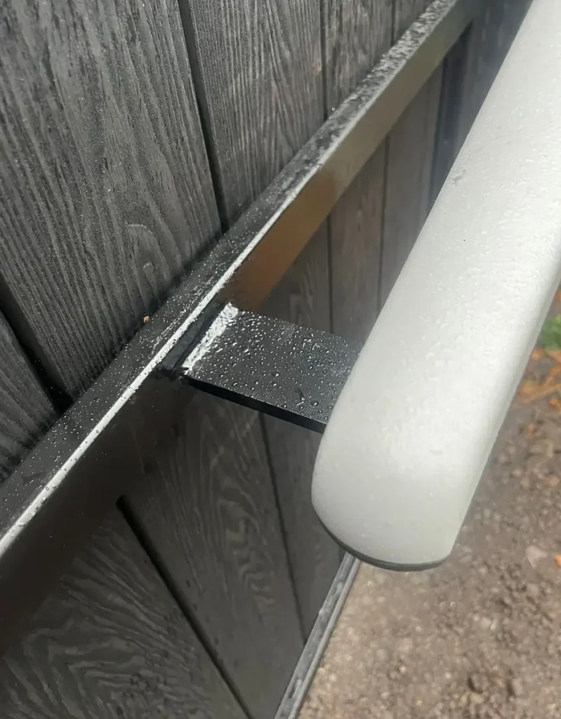 A hydraulic automation ram fitted to a gate during a Mr Gates visit