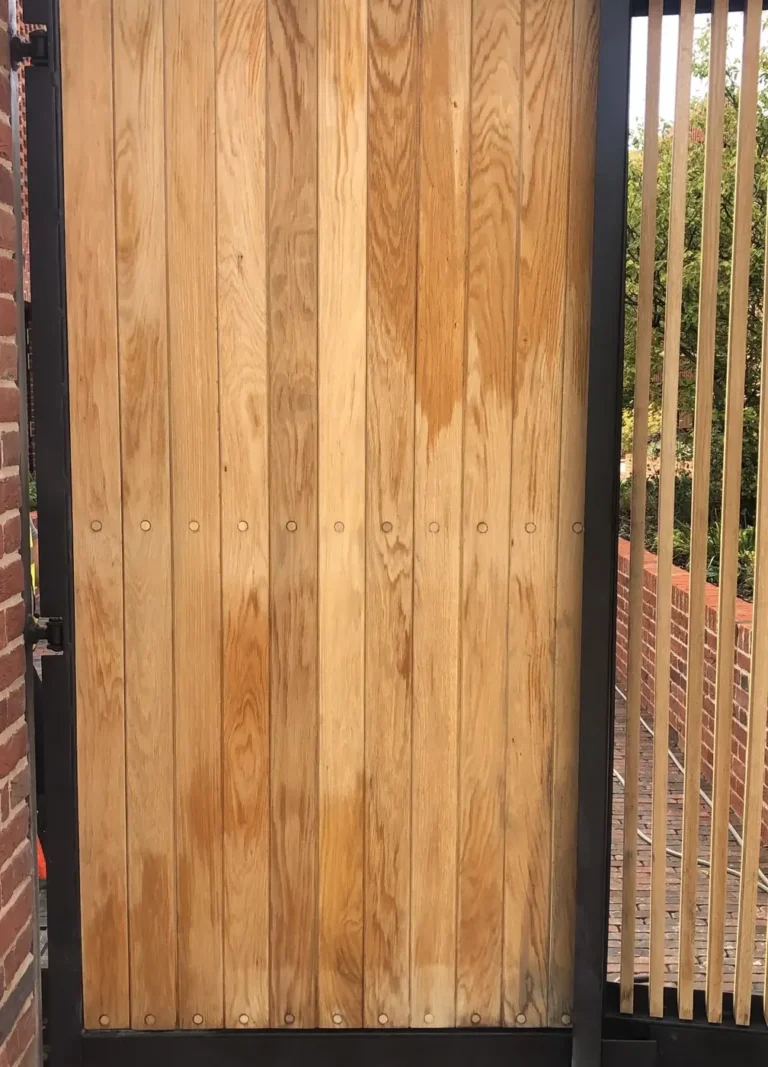 An oak timber-clad side gate in a steel frame, made in the Mr Gates workshop