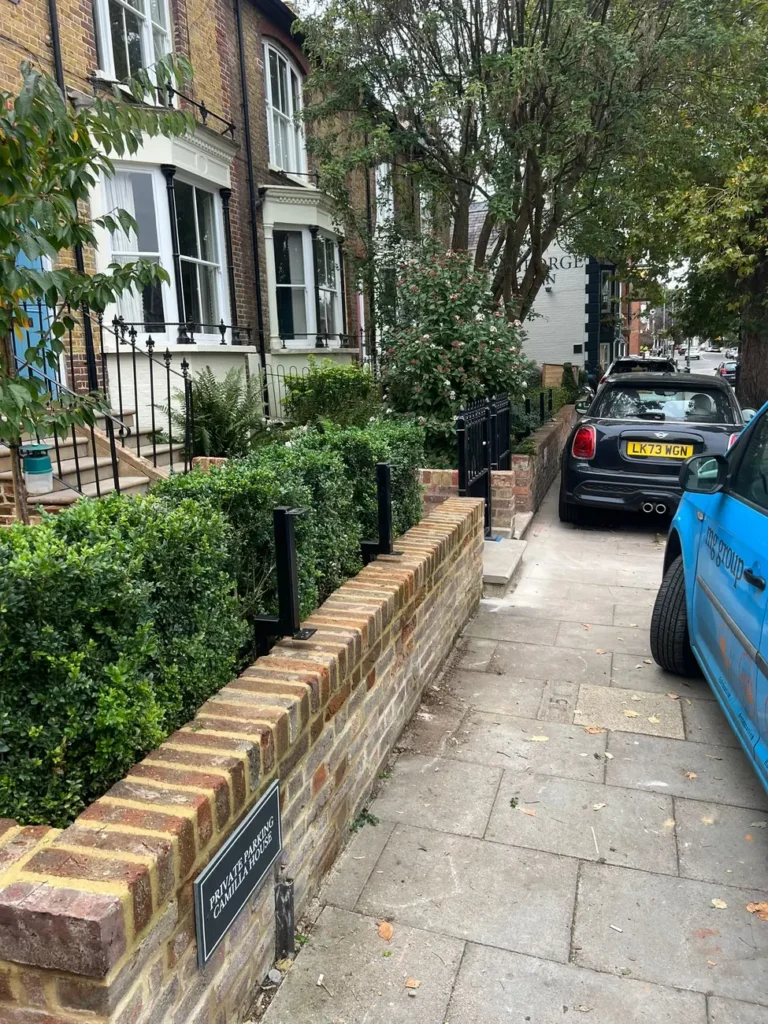 Traditional black railings along a period townhouse frontage