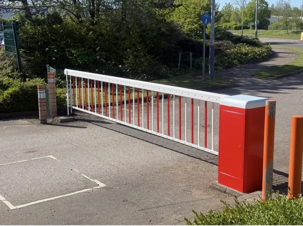 Automatic barrier with a skirted arm across a car park entrance