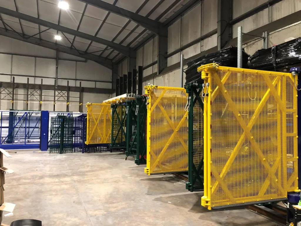 Bi-folding speed gates finished in yellow, blue and black