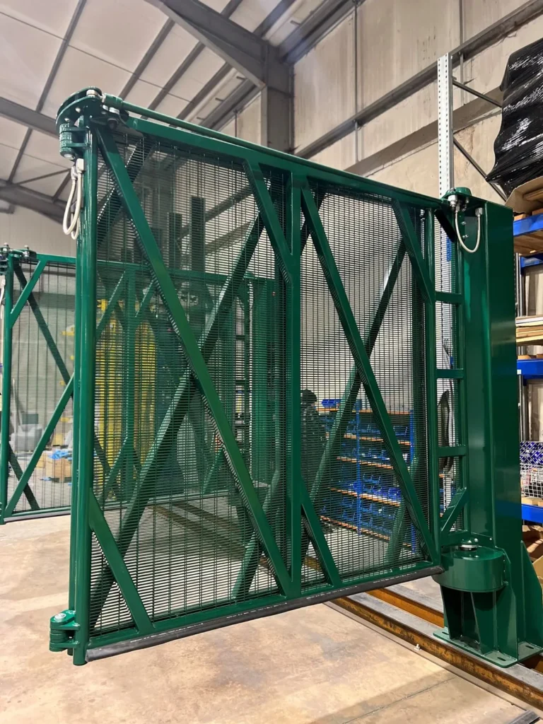 A green bi-folding speed gate leaf and tower, fully assembled
